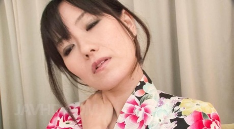 Japanese MILF Manami Komukai is relieved of her kimono before MMF sex 85604924