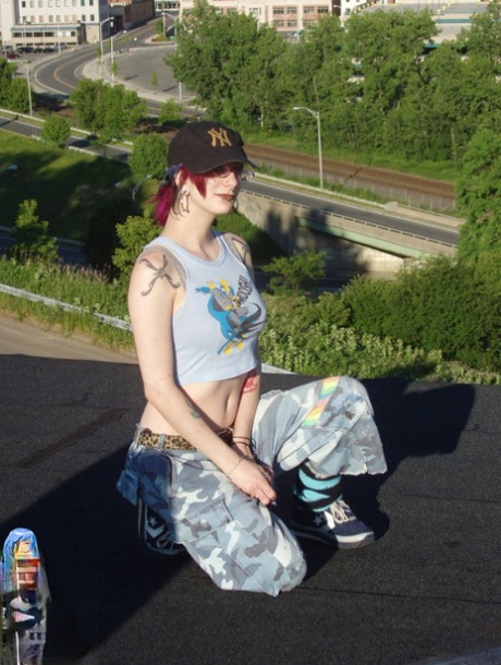 Redheaded girl with tattoos Bella Vendetta gets naked on the roof of a house 41804607