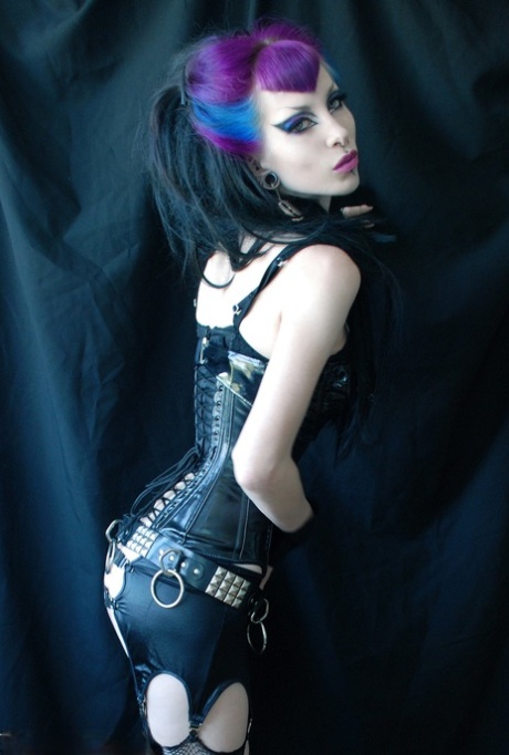Goth model Razor Candi puts her firm tits on display in torn hosiery 18999196
