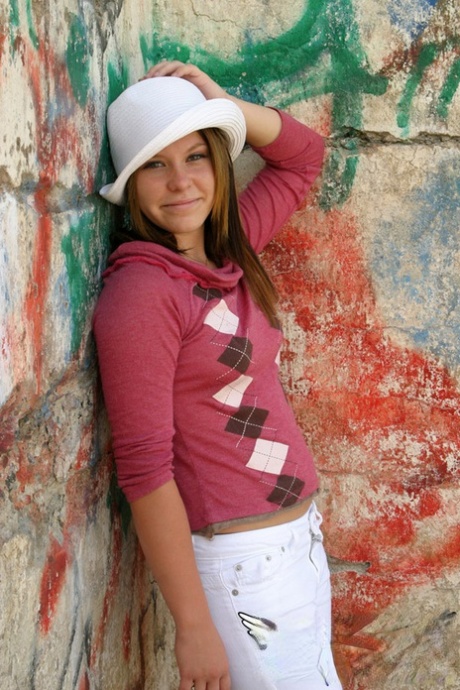 Young amateur Kandie covers up her naked breasts after stripping to a thong 97343656