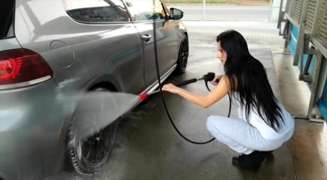Pregnant girl Lexi Dona shows her belly bump while washing her car 88829045