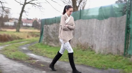 Wait girl Eveline Neill squats for a piss while out for a walk on a wet path 53449646