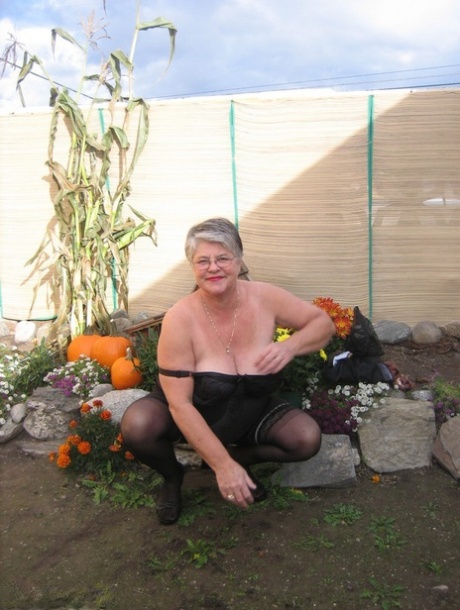 Fat nan Girdle Goddess sets her saggy boobs free of a girdle in the backyard 13501136