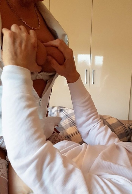 Older nurse Lorna Blu looses her boobs from uniform for a tit fuck during a BJ 21058331