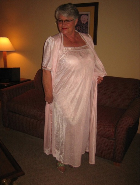 Amateur granny on the heavy side shows her pussy in lingerie and tan nylons 22809809