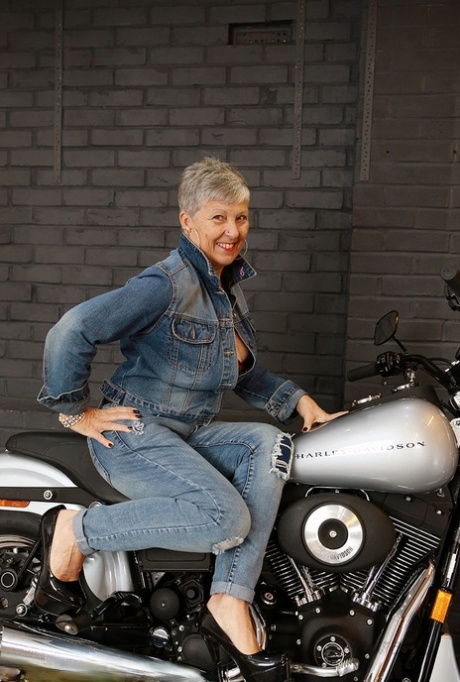 Old amateur Savana models lingerie on top of a Harley Davidson motorcycle 29594320