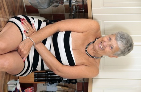 Old woman with short grey hair bares saggy tits as she strips naked 29842615