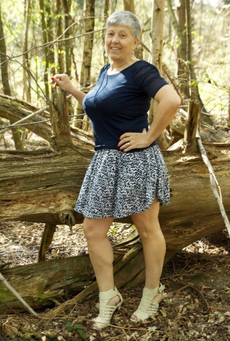 Bold old granny Savana shows off her tremendous saggy boobs in the forest 36584899