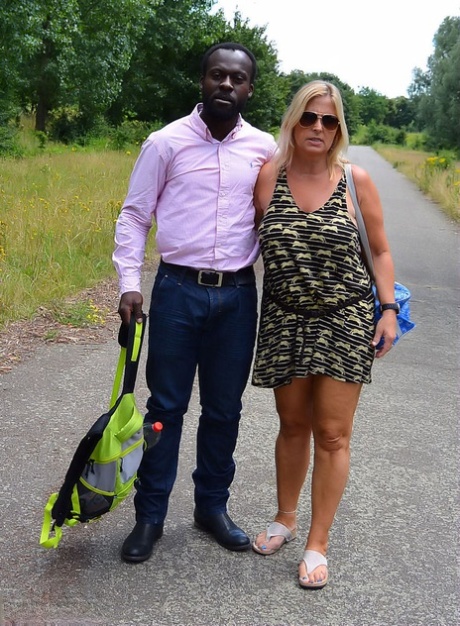 Busty blonde slut Chrissy has her pierced pussy exposed on interracial picnic 92050852