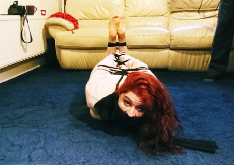 Thick redhead Mada Rose has her tits exposed while in bondage 16006062