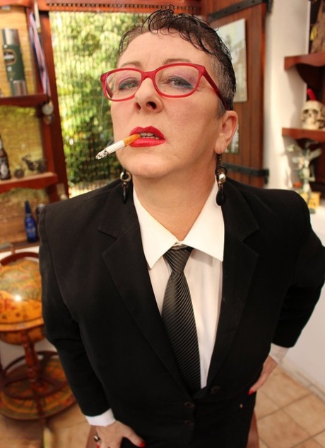 Mature Headmistress Mary Bitch fingers her pierced pussy after smoking 49941281