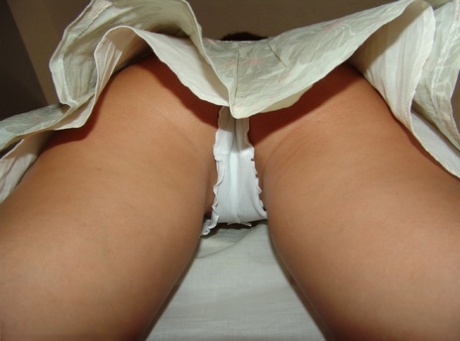 Redheaded amateur Nikki Sims shows her white panties during upskirt action 50442637