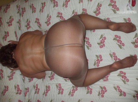 Chubby mature woman Busty Bliss removes pantyhose to model completely naked 15842881