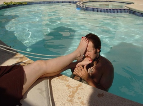 Dominant woman has her feet worshipped during poolside action 94879893