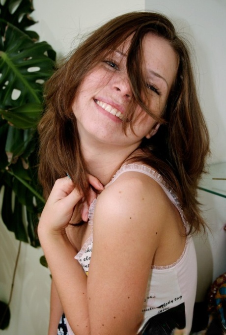 Charming young girl gets totally naked in a confident manner 88346430