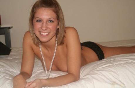 Caucasian teen poses topless upon a bed in black panties 35732640
