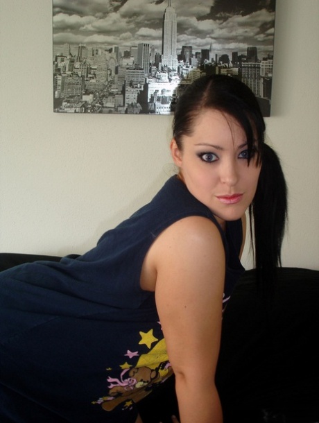 Solo girl takes self shots while going nude in a teasing manner 41842834