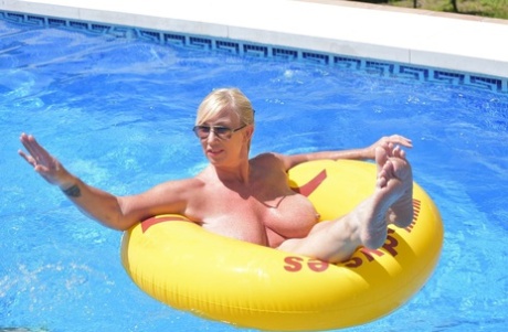 Blonde amateur Melody displays her overweight body in a swimming pool 93396854