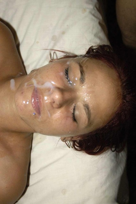 Redhead chick Jada Jones sticks out pierced tongue during bukkake action 58934921