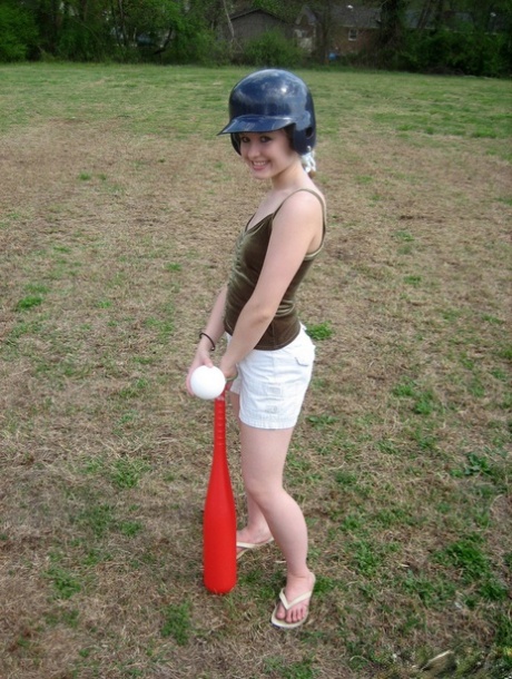 Charming teen exposes her small tits while wearing a batting helmet 47669227