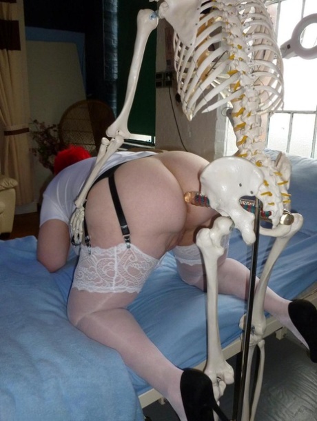 Older redhead nurse Valgasmic Exposed gets banged by a dildo wielding skeleton 54969004