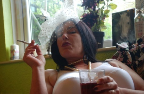 Older British amateur Juicey Janey exposes her bush while smoking & drinking 28627935