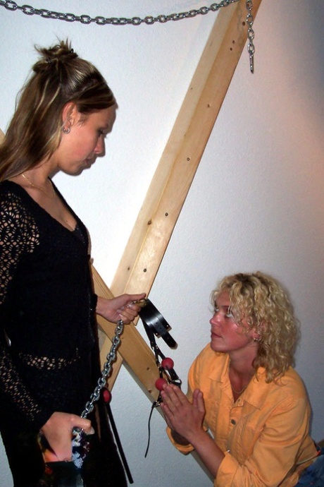 Blonde Lea is affixed to a St Andrew's Cross by a dominant lesbian 10482309