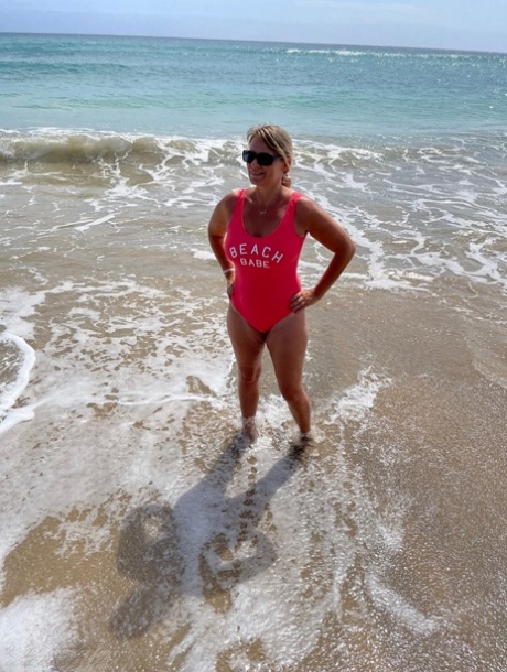 Middle-aged blonde Sweet Susi gets totally naked on a sandy beach 81528455