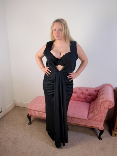 Plump blonde Sindy Bust gets naked on a chaise lounge in her stockings 59695641