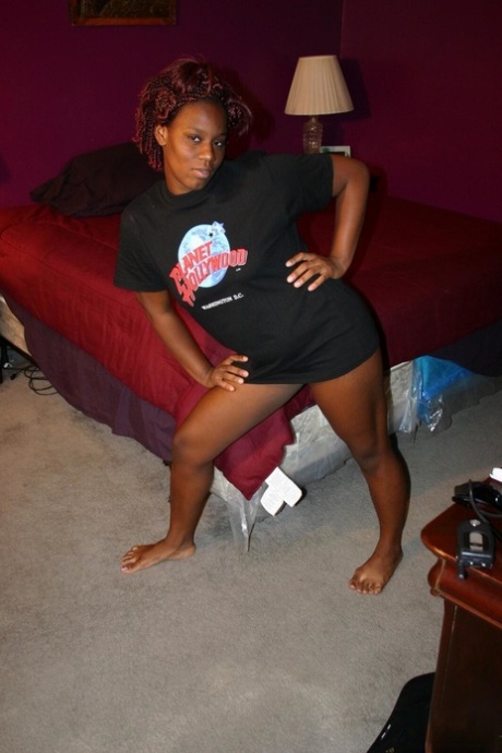 Ebony amateur Tina fondles her natural tits while getting butt naked 92331894