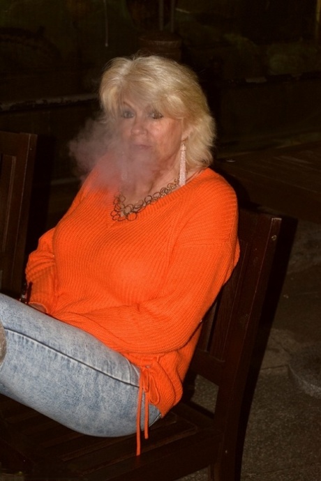 Mature blonde Dimonty strips down to over the knee boots at a hotel 92002426