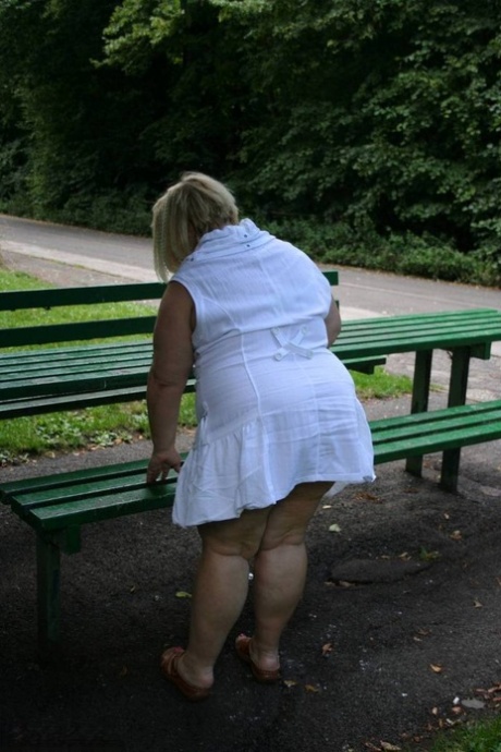 Obese UK blonde Lexie Cummings plays with her pierced pussy on public table 20847494
