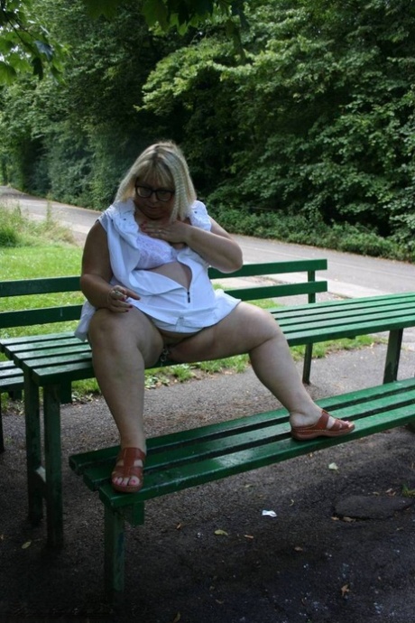Obese UK blonde Lexie Cummings plays with her pierced pussy on public table 20847494
