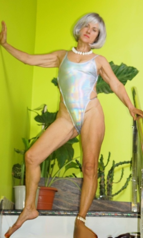 Older blonde Diana Ananta finger spreads her bush while naked on the stairs 96458737
