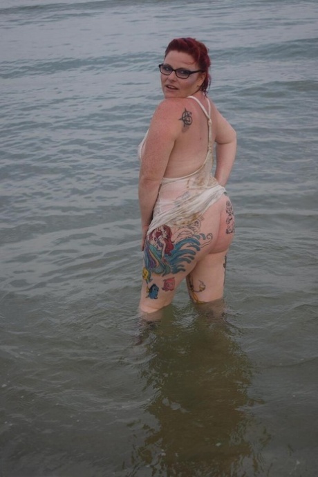 Mature UK redhead Mollie Foxxx exposes her tits and pussy while in the ocean 34265812