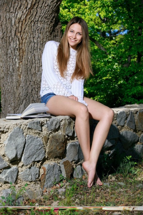 Barefoot teen Violet puts down her book to get naked on country fence 59899425