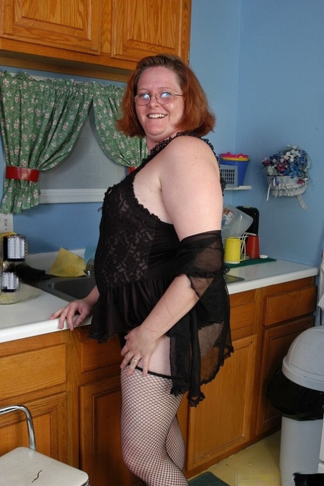 Fat redhead mature MILF Adrienne showcasing her big ass in stockings 32751302