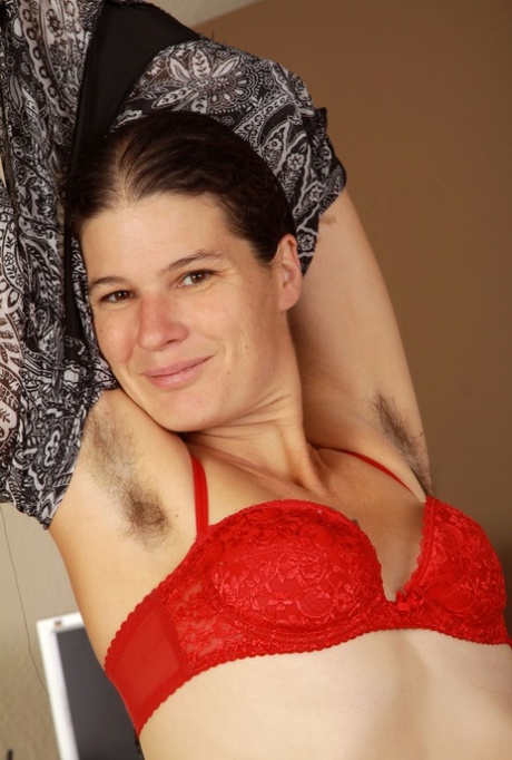 Older woman with unshaven legs exposes the rest of her fur covered body 68410362