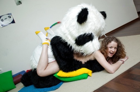 Sporty teenage girl enjoys a hardcore sex with her big panda toy 14091875