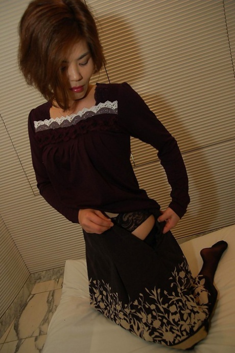 Asian lady Chika Ohara gets rid of her clothes and poses in sexy stockings 34723331