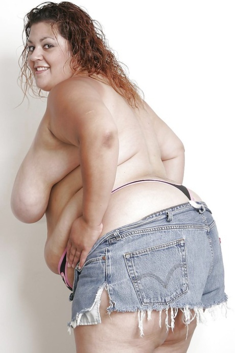 Extra large latina lady in jeans shorts undressing and spreading her lower lips 60000553